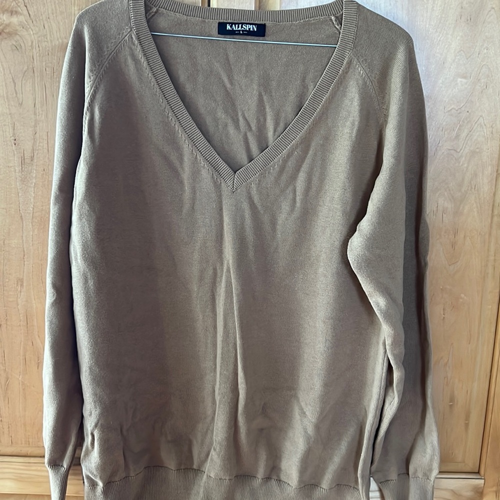 Tan, v-neck sweater with a flattering length